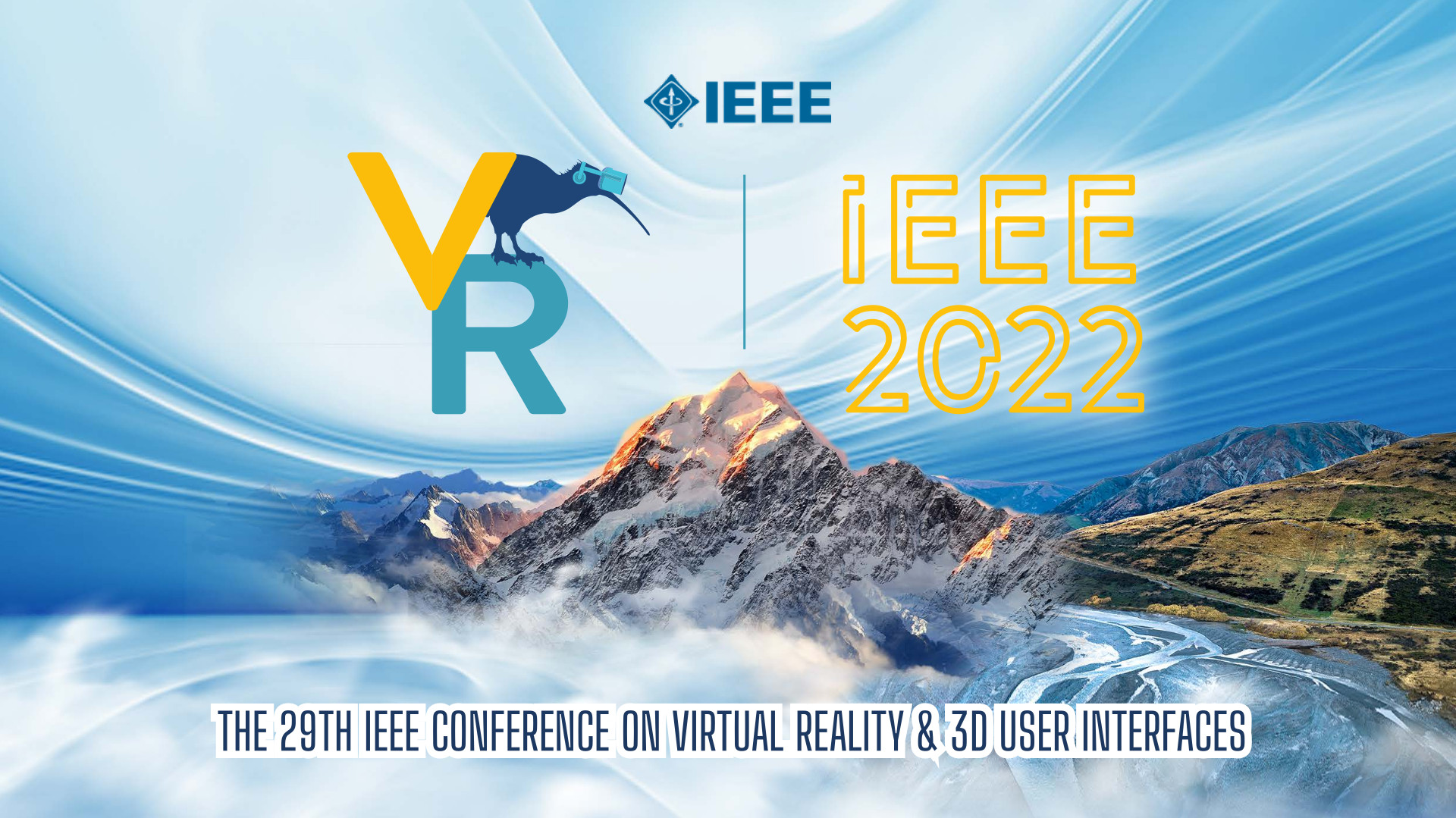 The IEEE VR 2022 logo imposed on an image of a mountain. The logo consists of VR written in yellow and blue, with a kiwi wearing a VR headset standing on top of the R.